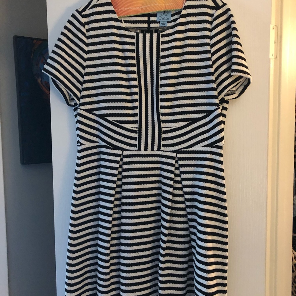 Knee Length A line dress. Back center zip.
